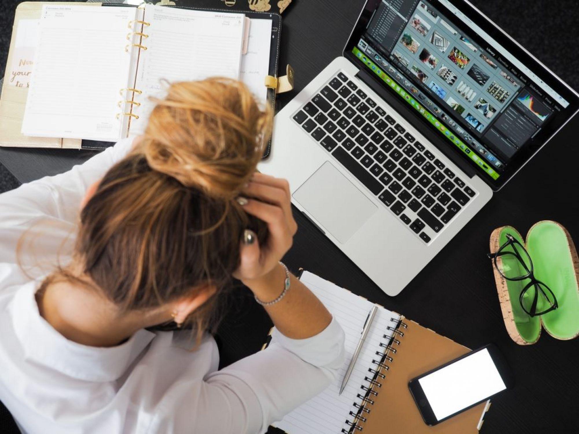 Image of a frustrated woman on her computer